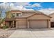 Attractive two-story home featuring a terracotta tile roof and a spacious three-car garage at 3239 E San Manuel Rd, San Tan Valley, AZ 85143