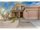 Attractive two-story home with desert landscaping, a three-car garage, and covered front porch at 3239 E San Manuel Rd, San Tan Valley, AZ 85143