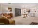 Open-concept living and dining area with carpet, built-in display case, and eat-in kitchen at 3239 E San Manuel Rd, San Tan Valley, AZ 85143