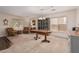 Spacious living and dining area featuring carpet flooring, neutral walls, and two large windows at 3239 E San Manuel Rd, San Tan Valley, AZ 85143
