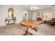 Formal living and dining area with carpet flooring, a large table, and elegant chandelier at 3239 E San Manuel Rd, San Tan Valley, AZ 85143
