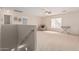 Upstairs loft with neutral carpeting, ample space for relaxing or entertaining, and natural lighting at 3239 E San Manuel Rd, San Tan Valley, AZ 85143