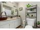 Clean bathroom featuring decor accents, framed mirror, storage and toilet at 3340 W Ironwood Dr, Phoenix, AZ 85051