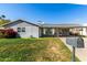 Charming single-story home with well-maintained lawn and covered parking at 3340 W Ironwood Dr, Phoenix, AZ 85051