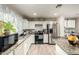 Bright kitchen with stainless steel appliances and white cabinetry at 3340 W Ironwood Dr, Phoenix, AZ 85051