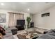 Open living room with comfortable gray sofa and large glass coffee table at 3340 W Ironwood Dr, Phoenix, AZ 85051