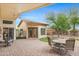 Beautiful covered back patio, featuring pavers and desert landscaping at 3767 N 162Nd Ln, Goodyear, AZ 85395