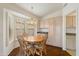 Cozy breakfast nook with a bay window, plantation shutters, and custom cabinetry at 3767 N 162Nd Ln, Goodyear, AZ 85395