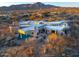 Expansive aerial view of desert home with pool, mountain backdrop and desert vegetation at 40635 N 109Th Pl, Scottsdale, AZ 85262