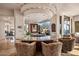 Stylish wet bar area with granite countertops, custom lighting, and a view into adjacent rooms at 40635 N 109Th Pl, Scottsdale, AZ 85262