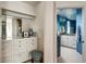 Bright primary bathroom boasts dual vanities, great lighting, and blue walls at 40635 N 109Th Pl, Scottsdale, AZ 85262