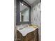 Powder room with designer wallpaper, modern fixtures, and marble countertop at 40635 N 109Th Pl, Scottsdale, AZ 85262