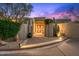 Stunning front entrance with desert landscaping and a beautiful door sets an inviting tone to the home at 40635 N 109Th Pl, Scottsdale, AZ 85262