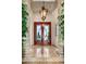 Elegant foyer features marble floors, glass front door, and decor lighting at 40635 N 109Th Pl, Scottsdale, AZ 85262