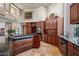 Spacious kitchen with modern gas range, stainless appliances, tile floor, and custom cabinetry at 40635 N 109Th Pl, Scottsdale, AZ 85262
