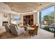 Cozy Gathering room featuring a fireplace, built-in media center, carpeted floors, and a picturesque view at 40635 N 109Th Pl, Scottsdale, AZ 85262