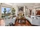Bright living room with a fireplace, comfortable seating, hardwood floors, and a view of the outdoor landscape at 40635 N 109Th Pl, Scottsdale, AZ 85262