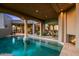 Inviting backyard pool with adjacent fireplace, and indoor/outdoor living at 40635 N 109Th Pl, Scottsdale, AZ 85262