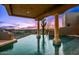 Inviting backyard pool with serene desert landscape, stucco columns and expansive view at 40635 N 109Th Pl, Scottsdale, AZ 85262