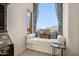Inviting window seat nook with bright patterned curtains and a view outside at 40635 N 109Th Pl, Scottsdale, AZ 85262