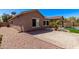 Secluded backyard featuring desert landscaping, a brick paver patio, and a sparkling swimming pool at 4086 E County Down Dr, Chandler, AZ 85249