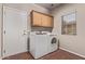 Laundry room with washer, dryer, cabinet and window at 4086 E County Down Dr, Chandler, AZ 85249
