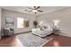 Inviting bedroom with a large window, stylish rug, and comfortable seating area at 4086 E County Down Dr, Chandler, AZ 85249