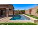 Beautiful backyard pool featuring a tiled edge, a lush green grassy area, and privacy walls at 4086 E County Down Dr, Chandler, AZ 85249