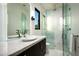Modern bathroom featuring a glass shower, sleek vanity, and a minimalist design, providing a spa-like experience at 41248 N 96Th St, Scottsdale, AZ 85262