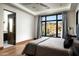 Comfortable bedroom featuring a large window with mountain views and a modern color palette at 41248 N 96Th St, Scottsdale, AZ 85262