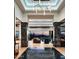 Grand foyer with stone columns and black marble floors leading to an open living space and sunset views at 41248 N 96Th St, Scottsdale, AZ 85262