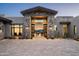 Elegant home entrance featuring stone accents and desert landscaping, offering a glimpse into the beautiful interior at 41248 N 96Th St, Scottsdale, AZ 85262