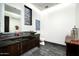 Modern powder room with unique stone accents, custom vanity, and stylish fixtures at 41248 N 96Th St, Scottsdale, AZ 85262