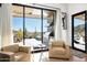 Cozy seating area with views of the desert landscape and an outdoor kitchen at 41248 N 96Th St, Scottsdale, AZ 85262