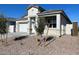 Charming single-story home featuring a two-car garage, stone accents, and desert landscaping at 5009 S 106Th Ave, Tolleson, AZ 85353
