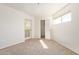 Bright bedroom with carpet, a window for natural light and a closet at 7494 E Earll Dr # 308, Scottsdale, AZ 85251