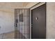 Front door with a security gate with an electronic keypad and a combination lockbox at 7494 E Earll Dr # 308, Scottsdale, AZ 85251