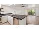 Open-concept kitchen featuring stainless steel appliances, a breakfast bar, and granite countertops at 7494 E Earll Dr # 308, Scottsdale, AZ 85251
