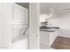 This kitchen has new appliances, black countertops, white cabinets, and washer/dryer at 7494 E Earll Dr # 308, Scottsdale, AZ 85251