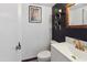 Chic bathroom featuring a modern vanity, updated fixtures, and decorative floating shelves at 8410 N 32Nd Ave, Phoenix, AZ 85051