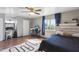 Comfortable bedroom with wood flooring, a ceiling fan, and lots of sunlight at 8410 N 32Nd Ave, Phoenix, AZ 85051