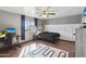 Comfortable bedroom featuring wood flooring, a ceiling fan, and a playful area rug at 8410 N 32Nd Ave, Phoenix, AZ 85051