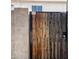 Wooden gate with security camera and beware of dog sign at 8410 N 32Nd Ave, Phoenix, AZ 85051