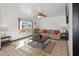 Inviting living area with large windows, tile flooring, ceiling fan, and comfortable furniture at 8410 N 32Nd Ave, Phoenix, AZ 85051