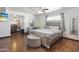 Spacious main bedroom boasts light-colored decor and hardwood floors and a ceiling fan at 8410 N 32Nd Ave, Phoenix, AZ 85051
