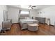Spacious primary bedroom boasts light-colored decor and hardwood floors and a ceiling fan at 8410 N 32Nd Ave, Phoenix, AZ 85051