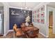 Stylish dining area with a chandelier, modern decor, and comfortable seating for four at 9451 E Becker Ln # 2013, Scottsdale, AZ 85260