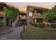 Charming exterior of a multi-level home with stucco siding and landscaped walkway at 9451 E Becker Ln # 2013, Scottsdale, AZ 85260