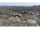 Expansive aerial view of a luxury estate with a long driveway and mountain views at 9643 E Cintarosa Pass, Scottsdale, AZ 85262