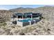 A modern home with infinity pool, mountain views, and a desert landscape at 9643 E Cintarosa Pass, Scottsdale, AZ 85262